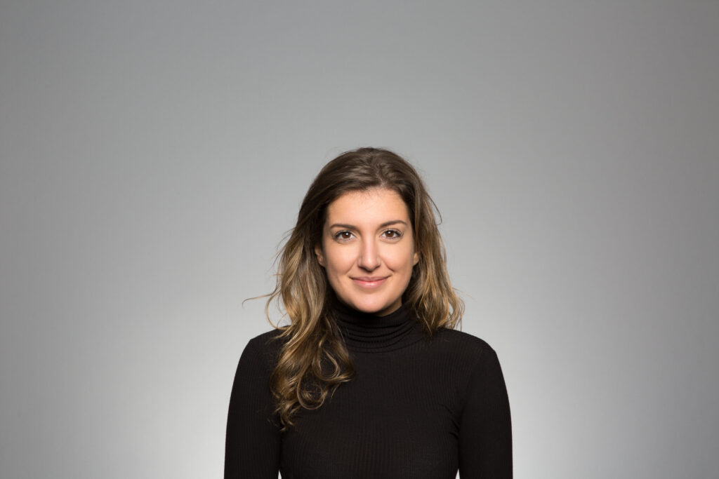 studio portrait of a thoughtful young woman